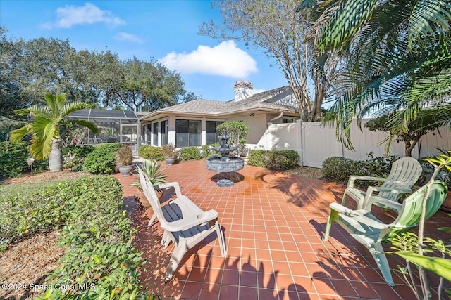 view of patio with a lanai