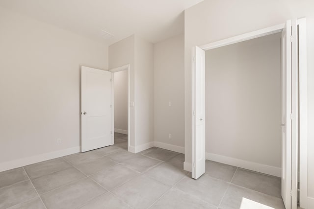 unfurnished bedroom featuring light tile patterned floors