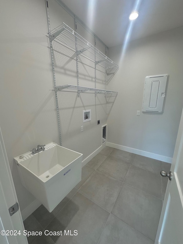 laundry room featuring hookup for a washing machine, electric panel, electric dryer hookup, and sink