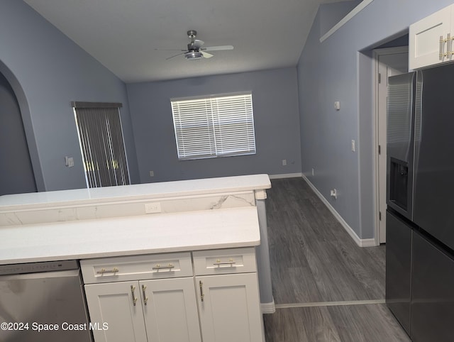 kitchen with white cabinetry, ceiling fan, dark wood-type flooring, vaulted ceiling, and appliances with stainless steel finishes