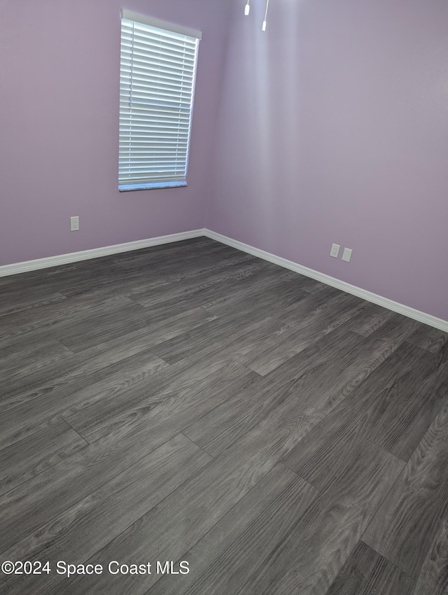 empty room featuring dark hardwood / wood-style floors