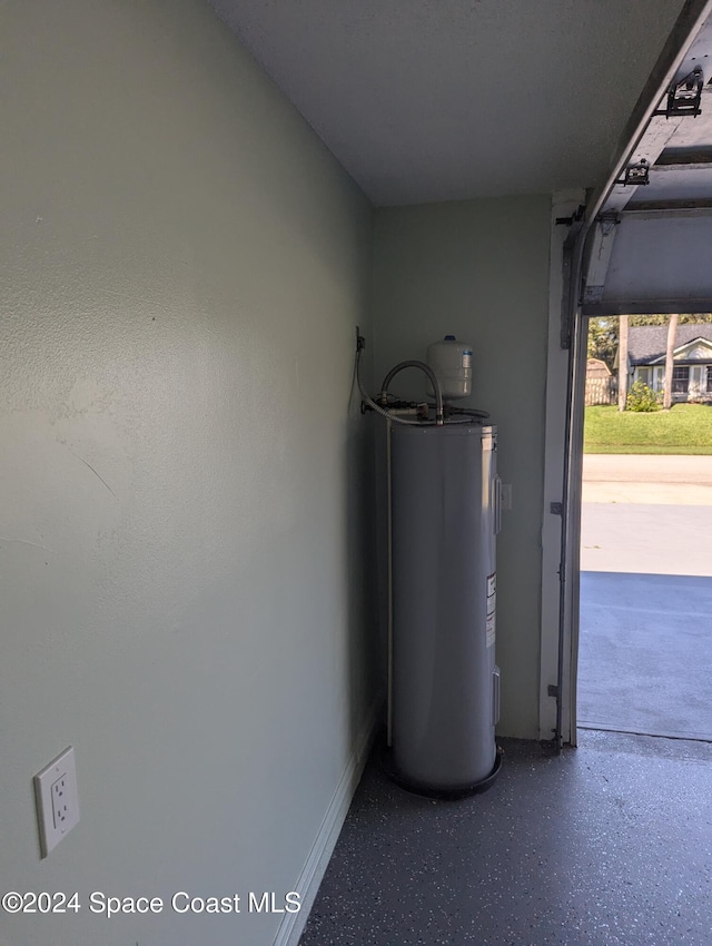 utility room featuring water heater