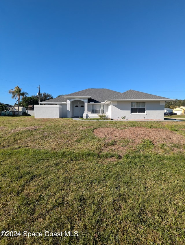 exterior space with a front lawn