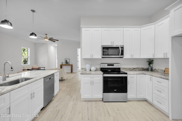 kitchen with white cabinetry, sink, and appliances with stainless steel finishes