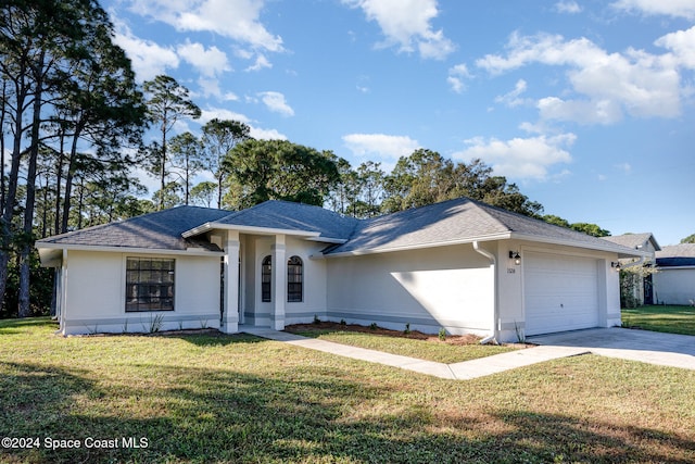 single story home with a front lawn and a garage