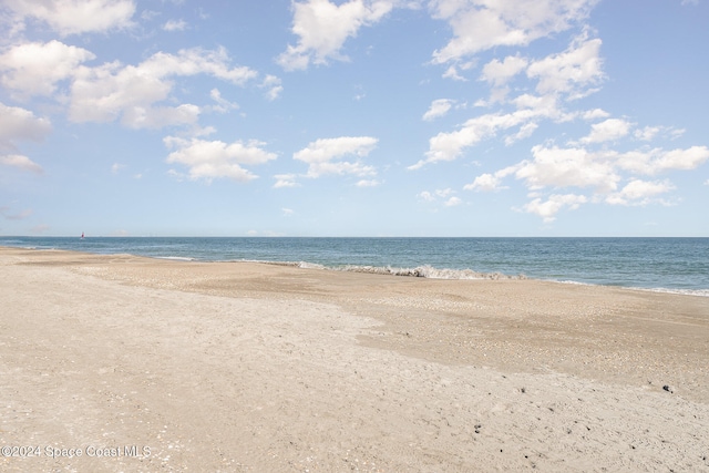 property view of water featuring a beach view