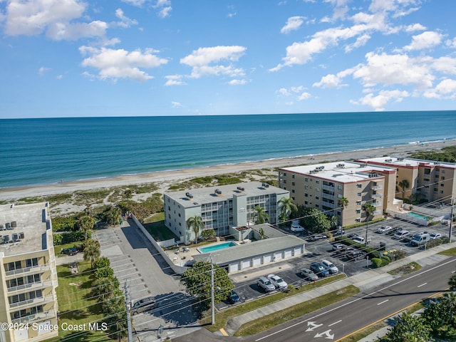 drone / aerial view with a view of the beach and a water view