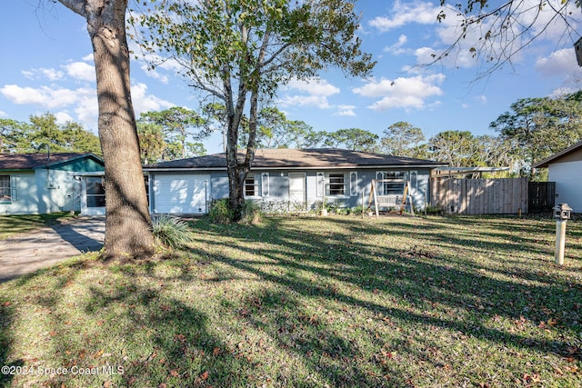 ranch-style home featuring a front yard