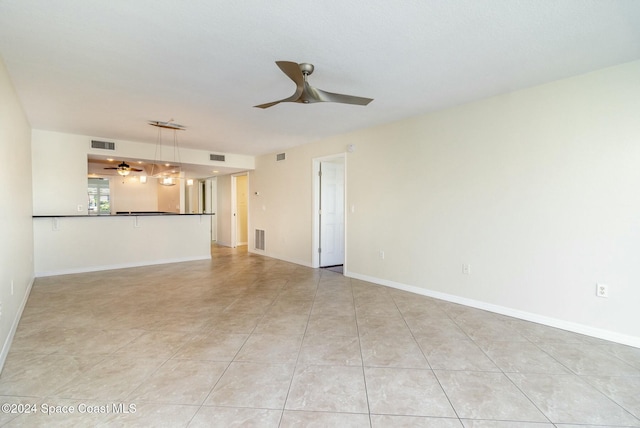 unfurnished living room with light tile patterned flooring