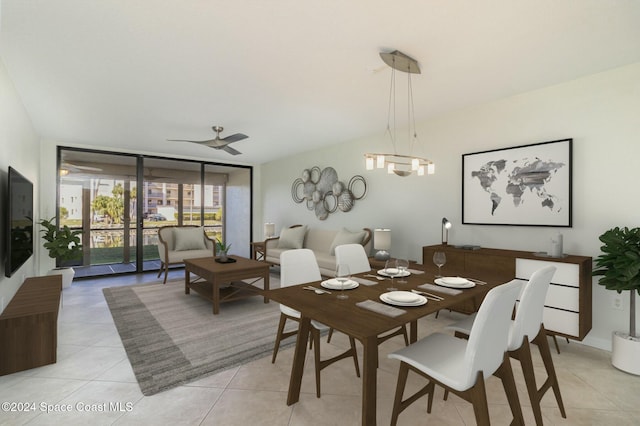 dining space featuring ceiling fan with notable chandelier, light tile patterned flooring, and floor to ceiling windows