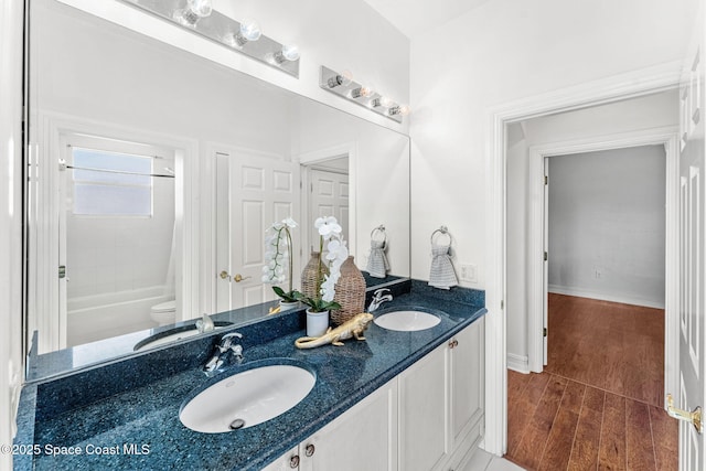 bathroom featuring bathing tub / shower combination and vanity