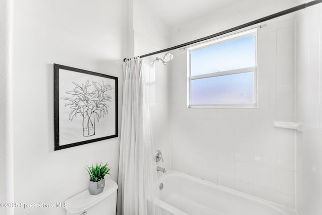 bathroom with shower / bath combo and toilet