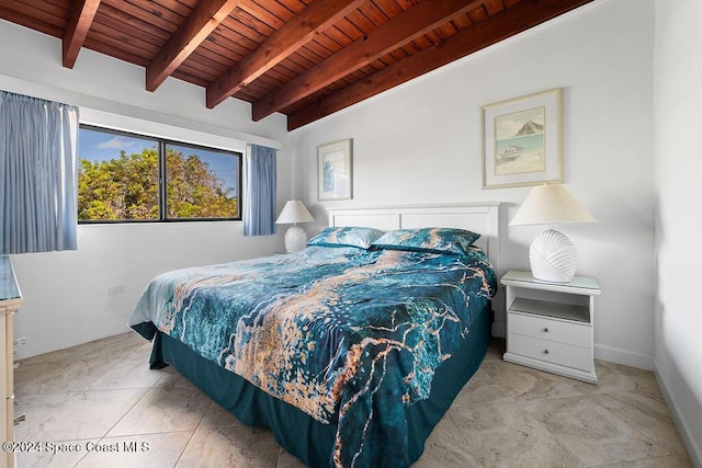 bedroom featuring beamed ceiling and wooden ceiling