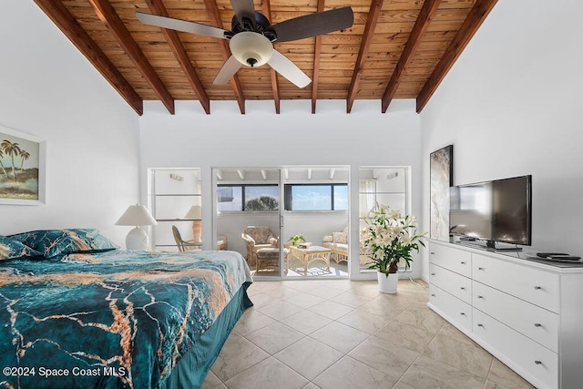 bedroom with beam ceiling, ceiling fan, a towering ceiling, light tile patterned flooring, and wood ceiling