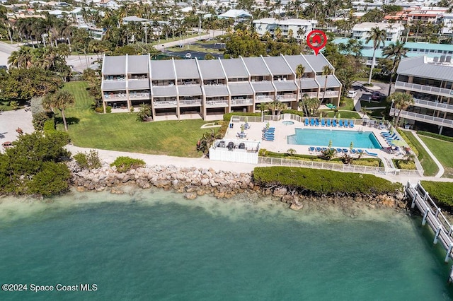 birds eye view of property with a water view