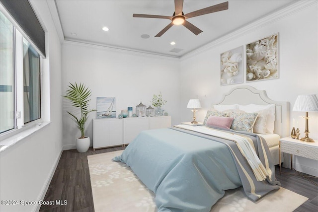 bedroom with recessed lighting, baseboards, wood finished floors, and crown molding