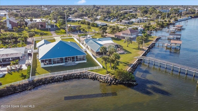 drone / aerial view featuring a residential view and a water view