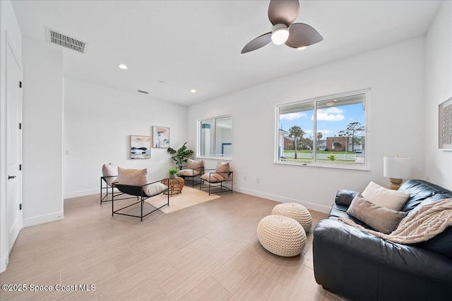 living room featuring recessed lighting, visible vents, baseboards, and ceiling fan