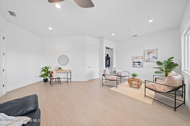 sitting room with visible vents, recessed lighting, and baseboards