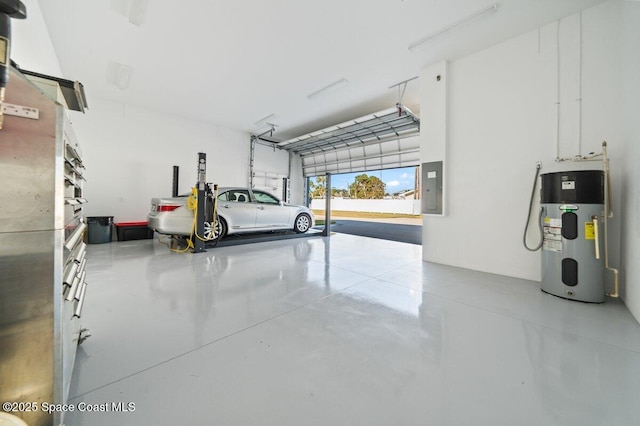 garage featuring electric panel and hybrid water heater