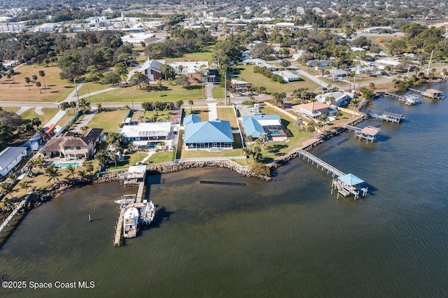 birds eye view of property featuring a water view and a residential view