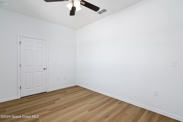 spare room featuring ceiling fan and light wood-type flooring