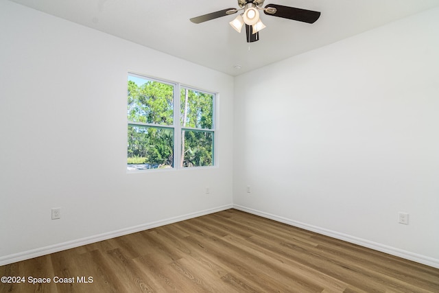 spare room featuring ceiling fan and hardwood / wood-style flooring