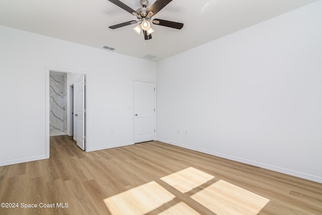 unfurnished bedroom featuring light wood-type flooring and ceiling fan