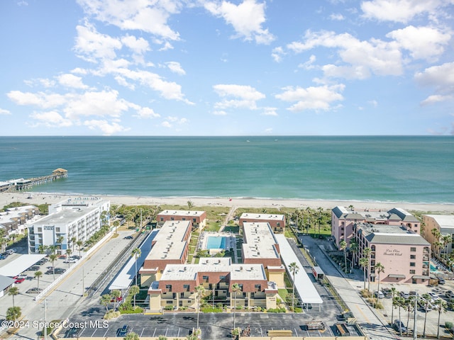 birds eye view of property featuring a view of the beach and a water view