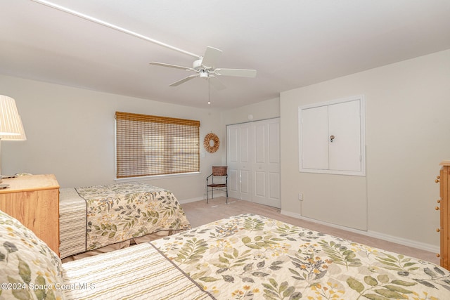 bedroom featuring ceiling fan and a closet