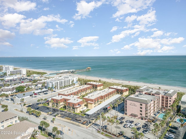 aerial view with a water view and a view of the beach