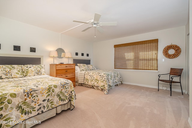 bedroom featuring ceiling fan and light colored carpet