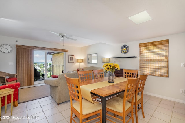 dining room featuring ceiling fan and light tile patterned floors