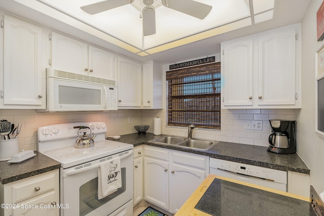 kitchen featuring white cabinetry and white appliances