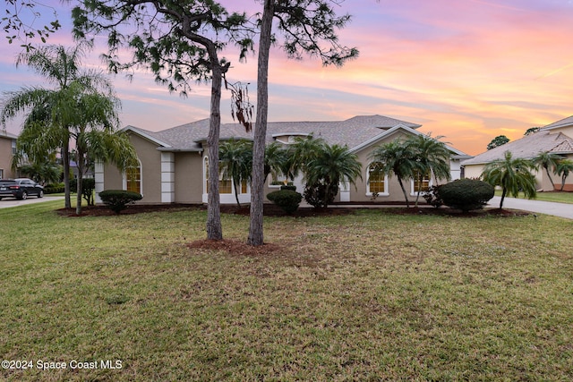 view of front of home with a lawn