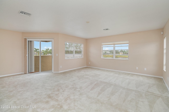 empty room featuring light colored carpet