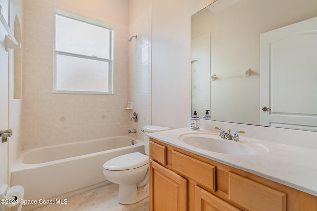 full bathroom with tile patterned flooring, vanity, toilet, and tiled shower / bath