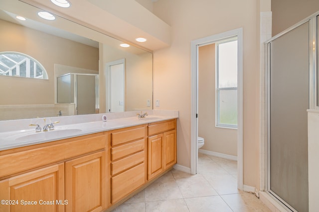 bathroom with a wealth of natural light, toilet, and walk in shower