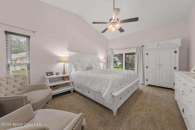 bedroom with carpet flooring, multiple windows, ceiling fan, and vaulted ceiling