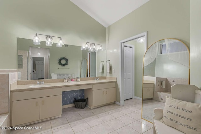 bathroom with vanity, high vaulted ceiling, and tile patterned floors