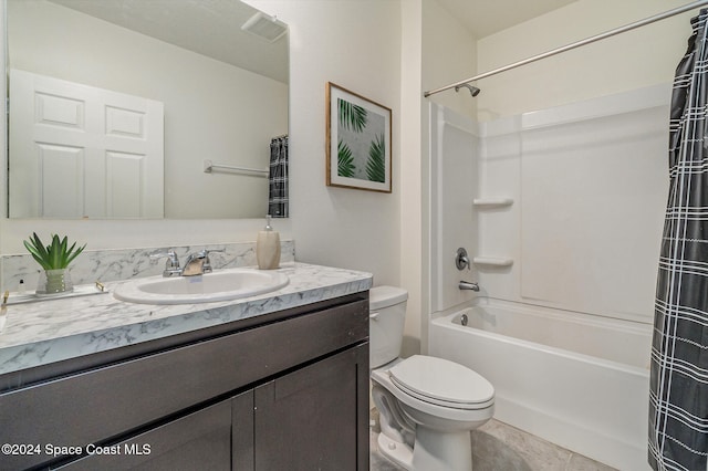 full bathroom with tile patterned floors, vanity, toilet, and shower / bath combo with shower curtain