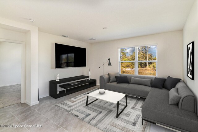 living room with tile patterned floors