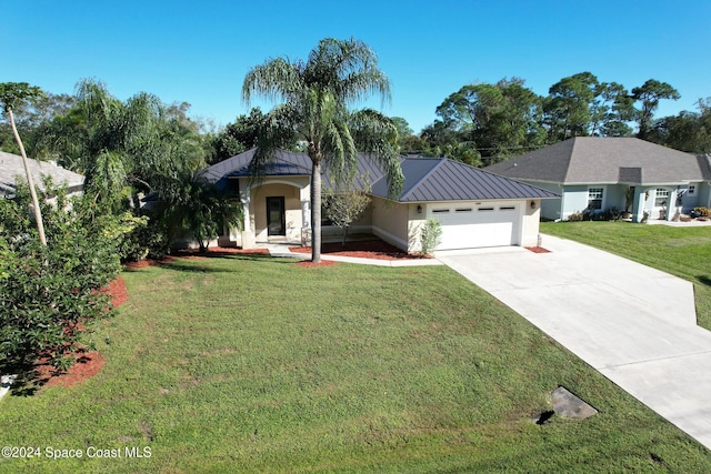 view of front of home with a garage and a front lawn