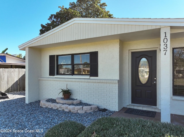 1037 Poinsetta St, Cocoa, FL 32927 - entrance to property with brick siding and stucco siding