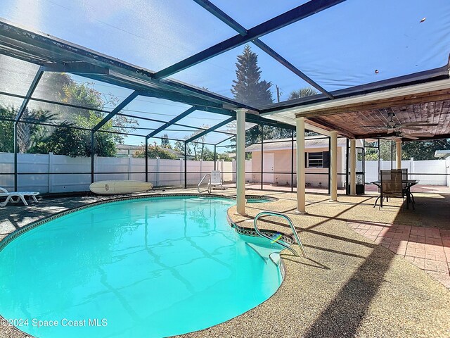 1037 Poinsetta St, Cocoa, FL 32927 - view of pool with a patio area, a fenced backyard, a lanai, and ceiling fan
