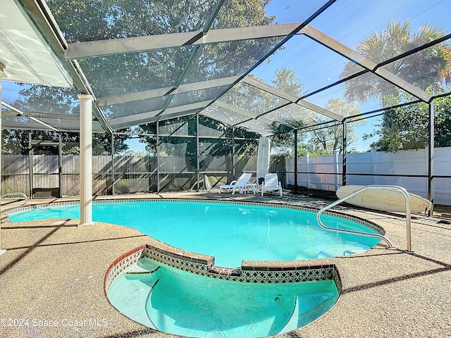 view of pool featuring a patio and a lanai