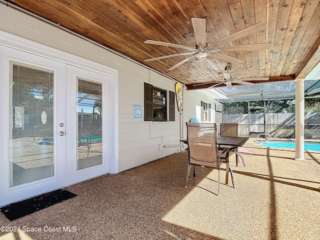 view of patio featuring a fenced in pool and french doors