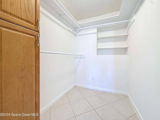 1037 Poinsetta St, Cocoa, FL 32927 - walk in closet with light tile patterned flooring