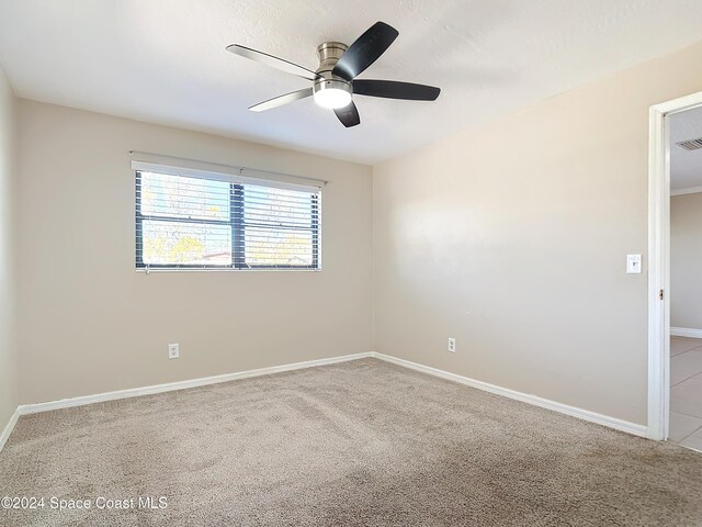 1037 Poinsetta St, Cocoa, FL 32927 - empty room featuring ceiling fan, carpet floors, and baseboards