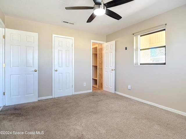 1037 Poinsetta St, Cocoa, FL 32927 - unfurnished bedroom with carpet floors, baseboards, and a ceiling fan